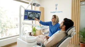 Dentist reviewing a dental x ray to diagnose the cause of tooth pain