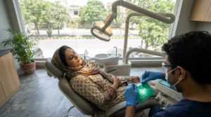 Root canal treatment being performed under a rubber dam in a modern dental clinic